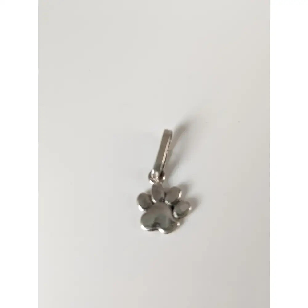 Silver steed paw print silver pendant with polished silver finish and small loop for easy attachment