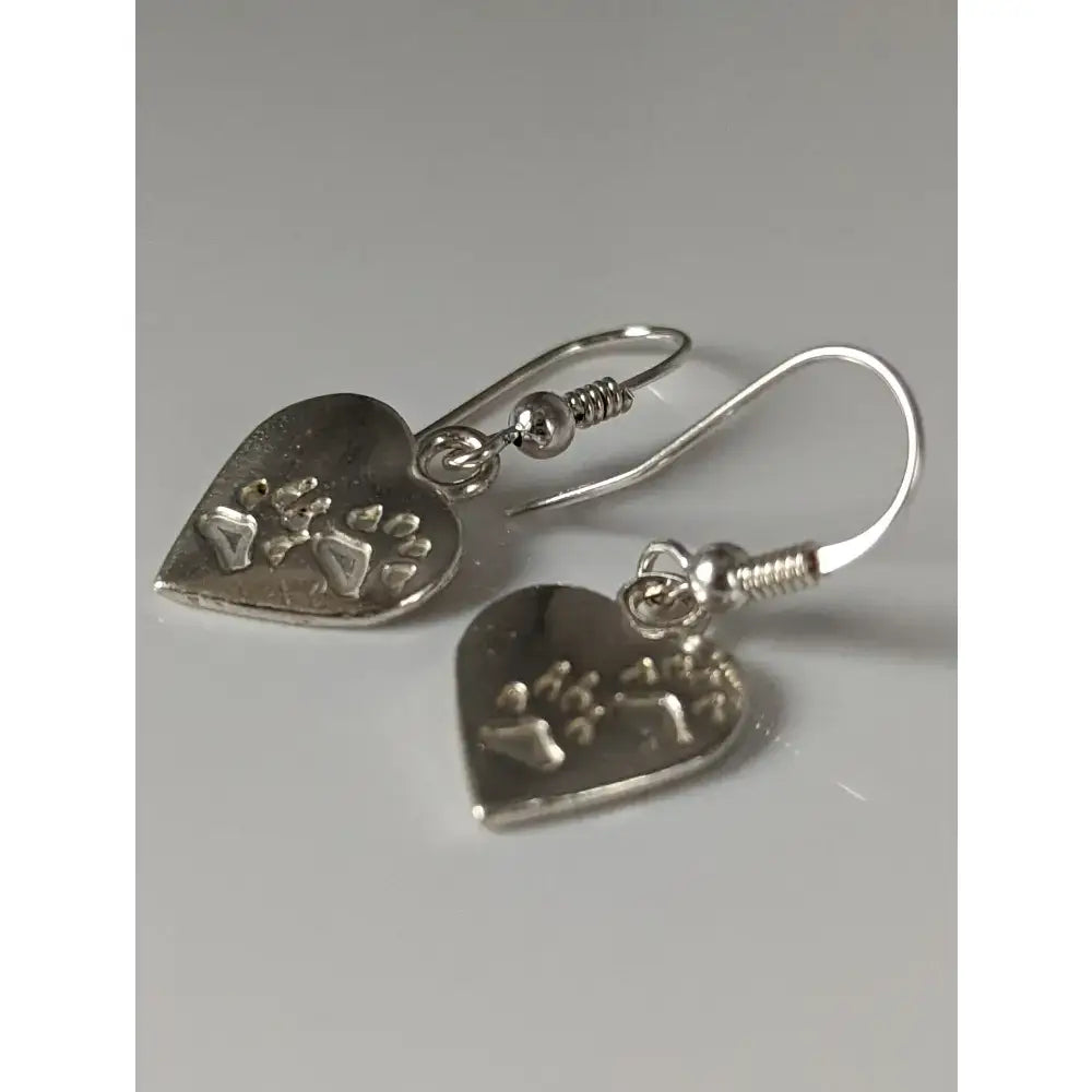 Silver steed paws silver dropped earrings with heart silver design and engraved paw prints on twisted wire hooks