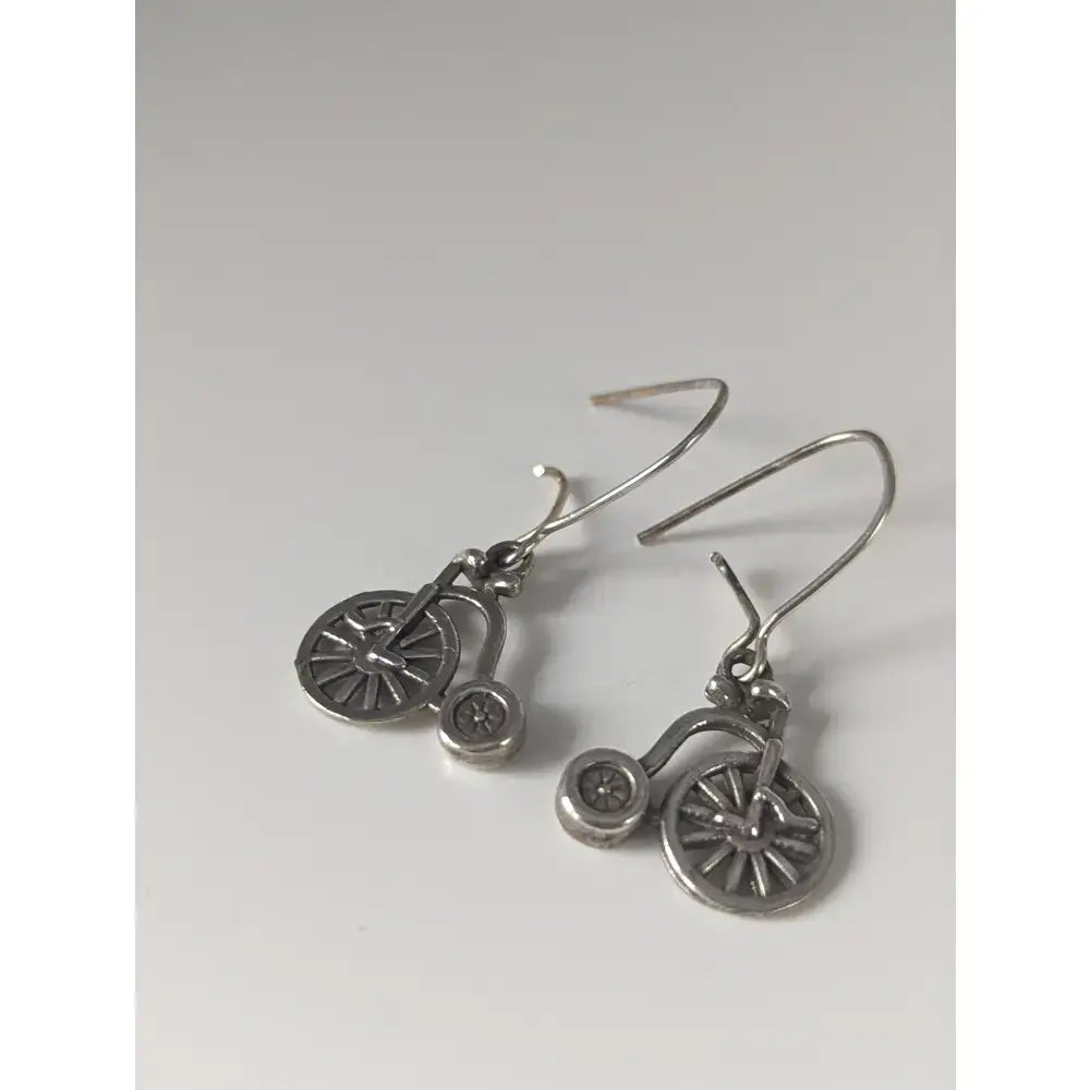 Silver steed penny farthing bike dropped earrings in silver with detailed spoked wheels and vintage design