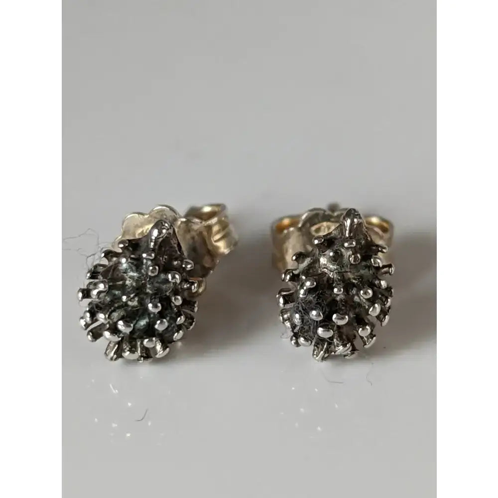 Silver steed pine cone stud earrings in silver with textured spiky design and clear gemstone studs