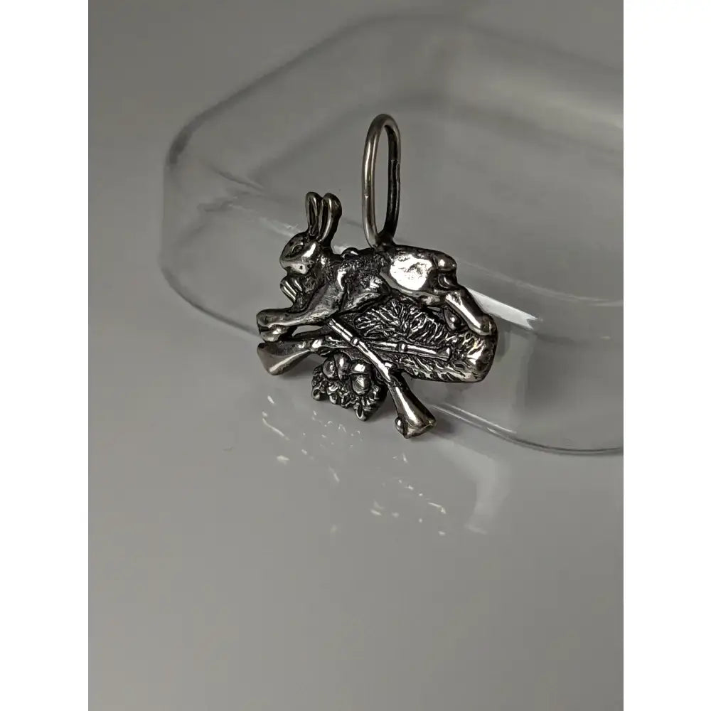 Silver steed rabbit hunting silver pendant with intricate bone and foliage detailing and attachment loop