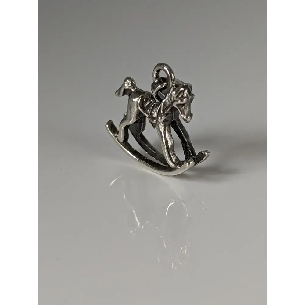 Silver steed rocking horse silver pendant charm with intricate detailing and polished metallic finish for equestrian jewelry