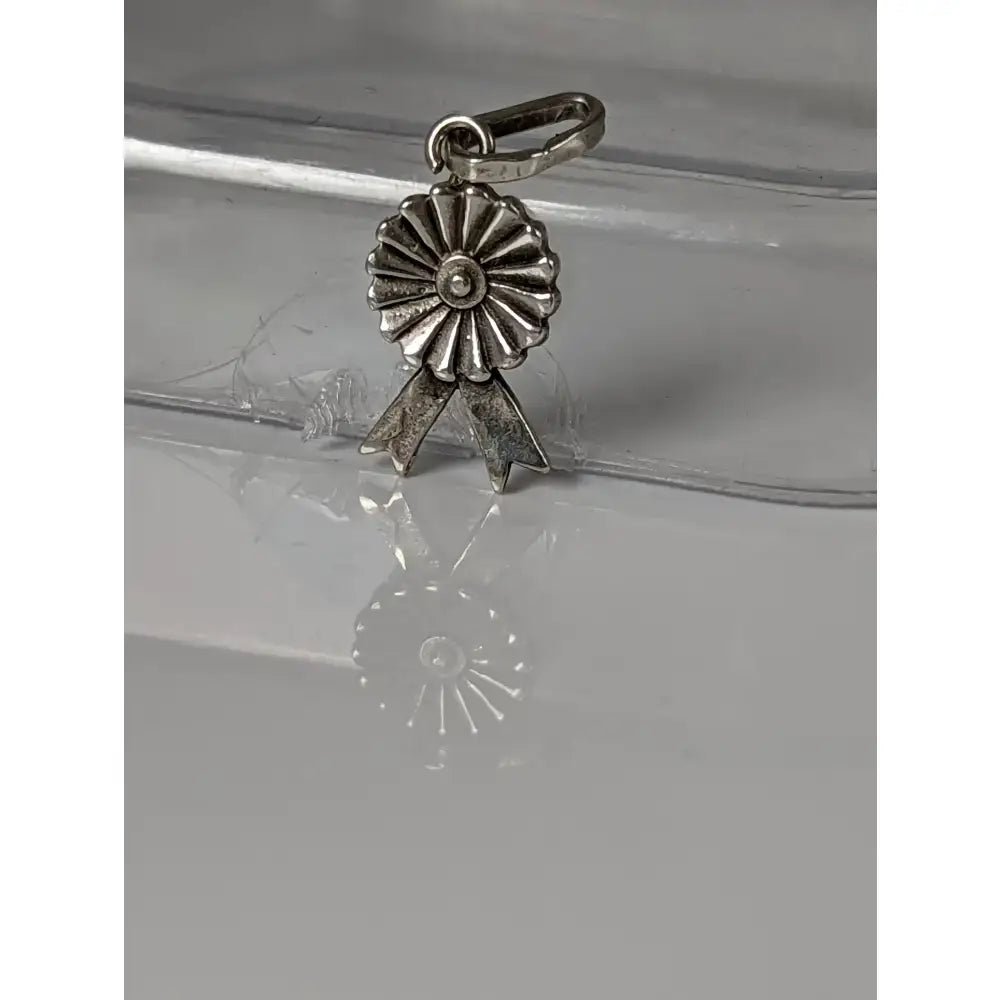Silver steed rosette silver pendant with a silver-colored metallic rosette silver pendant charm and sunburst design
