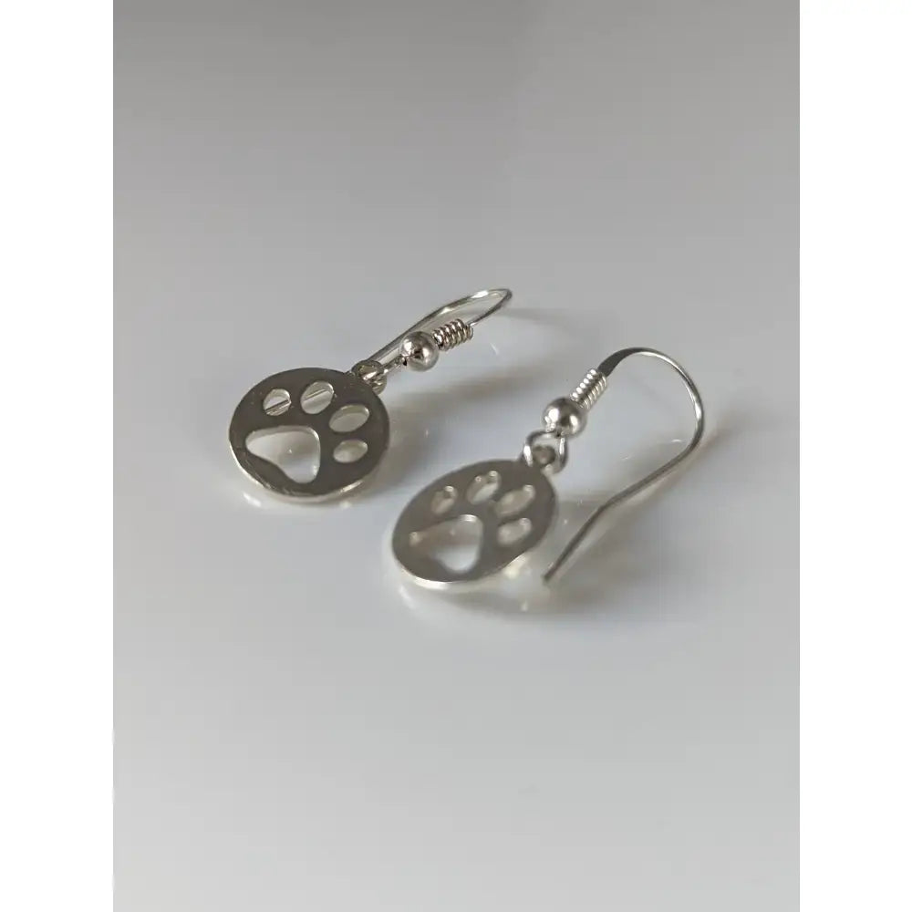 Silver steed sterling silver dropped earrings with polished paw print tag and simple hook clasps