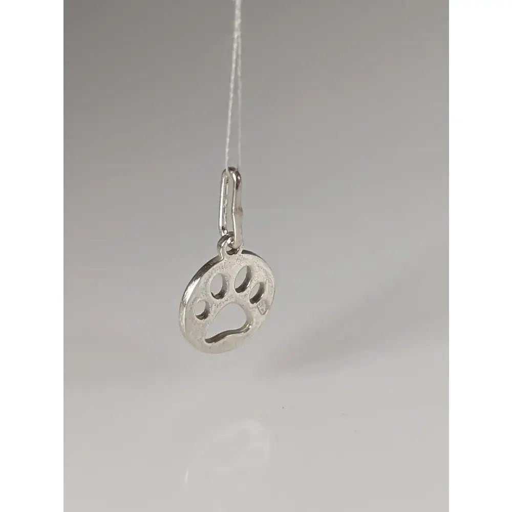 Silver steed pendant with a polished silver round paw print tag featuring cut-out details in a sleek design