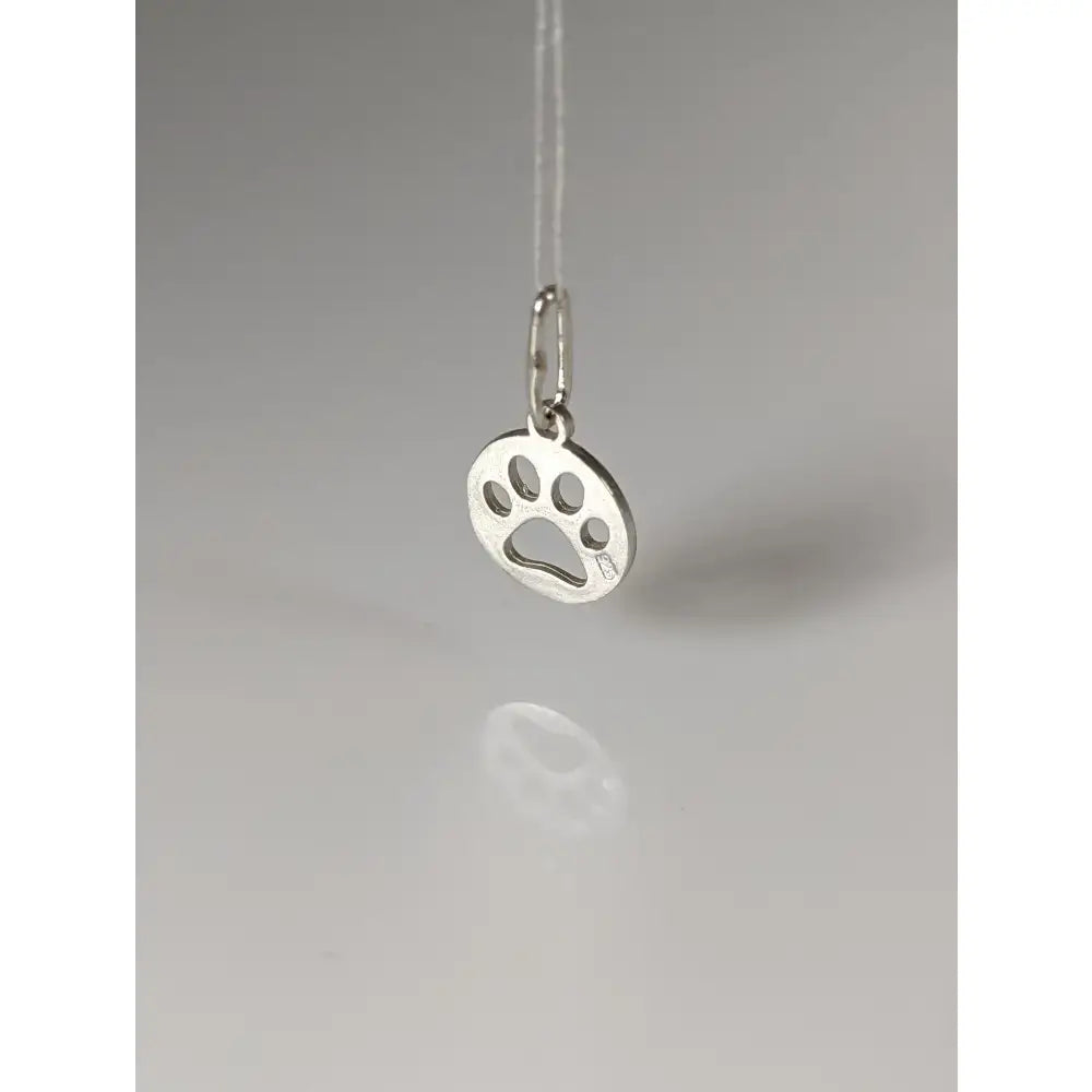 Silver steed pendant featuring a silver round paw print tag on a delicate chain perfect for pet lovers