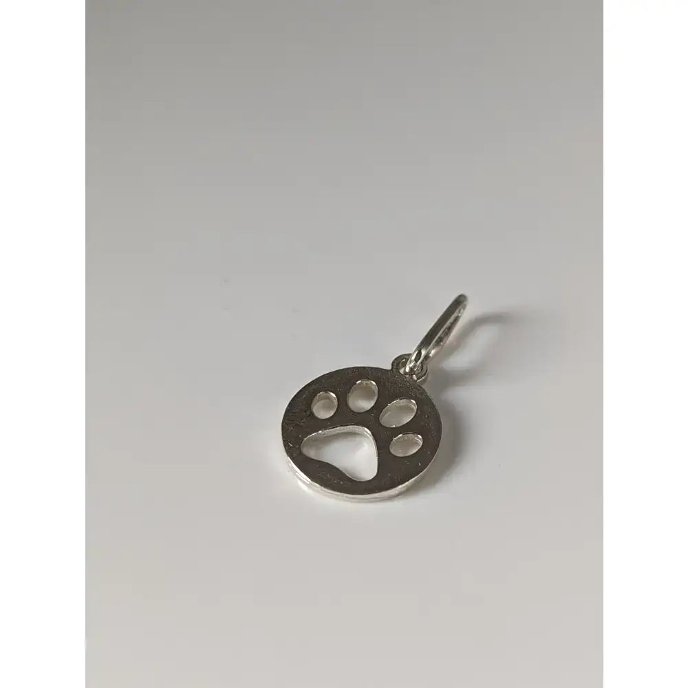 Silver steed pendant featuring a polished silver round paw print tag charm with a small loop for easy attachment