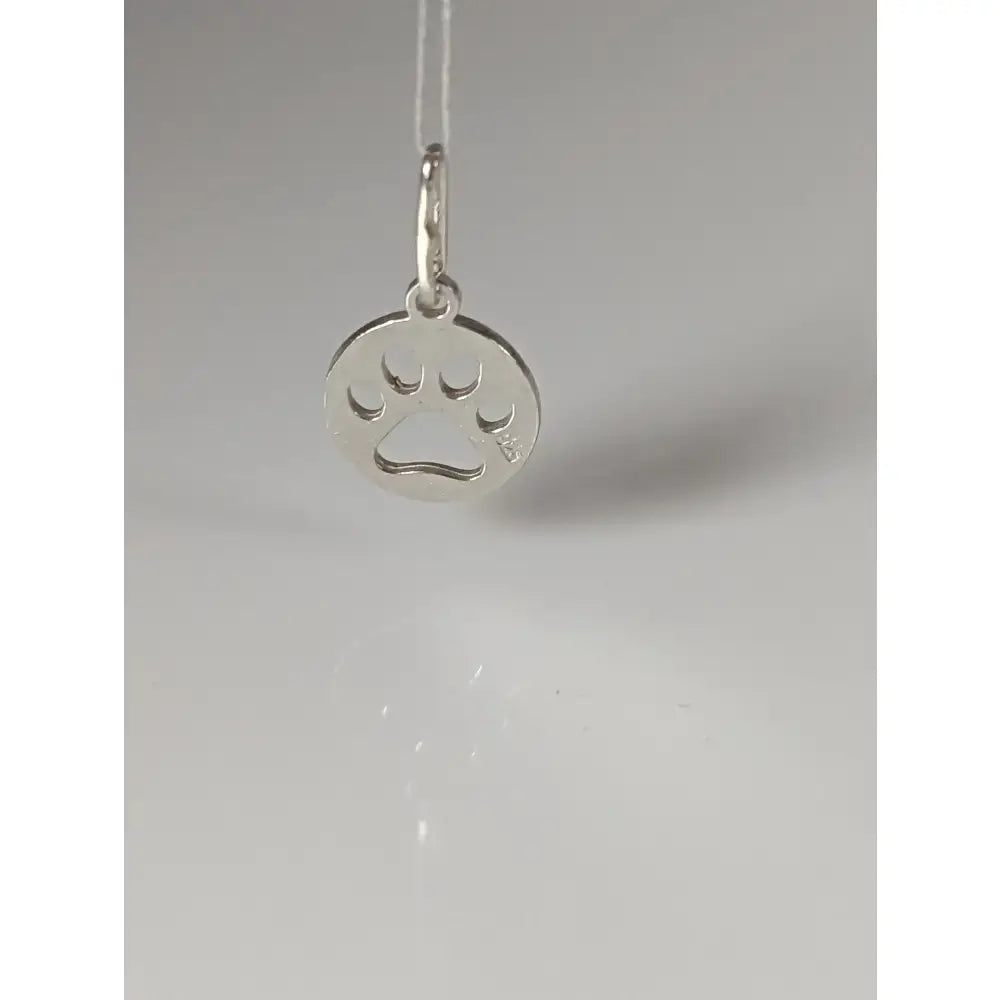 Silver steed pendant with a round paw print tag and small diamond accent in shiny silver material