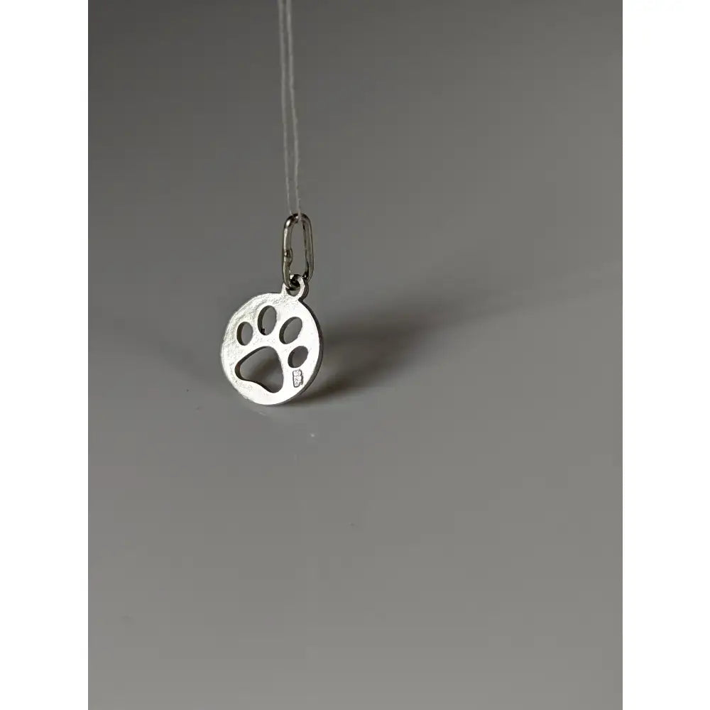 Silver steed pendant featuring a polished silver paw print tag with a round paw print cut-out design