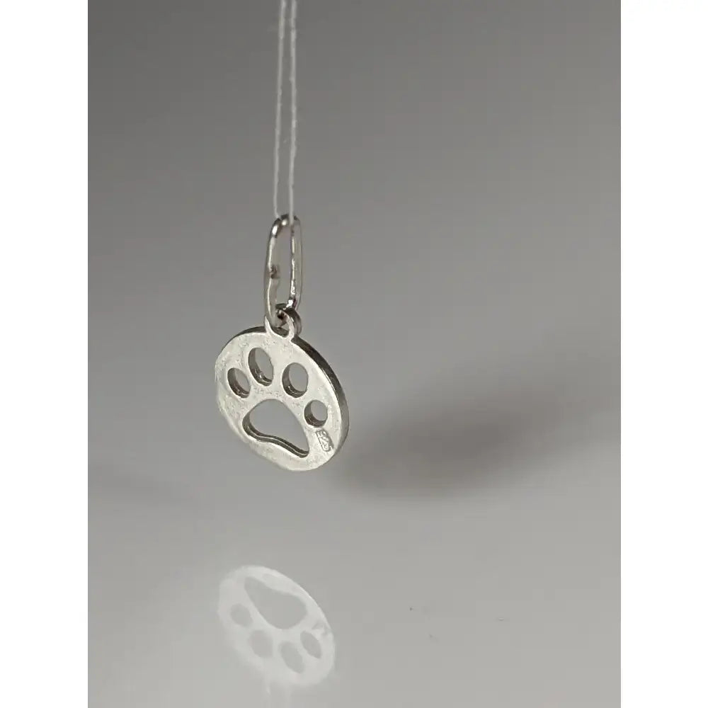 Silver steed pendant with a round silver paw print tag featuring a polished minimalist design and side engravings
