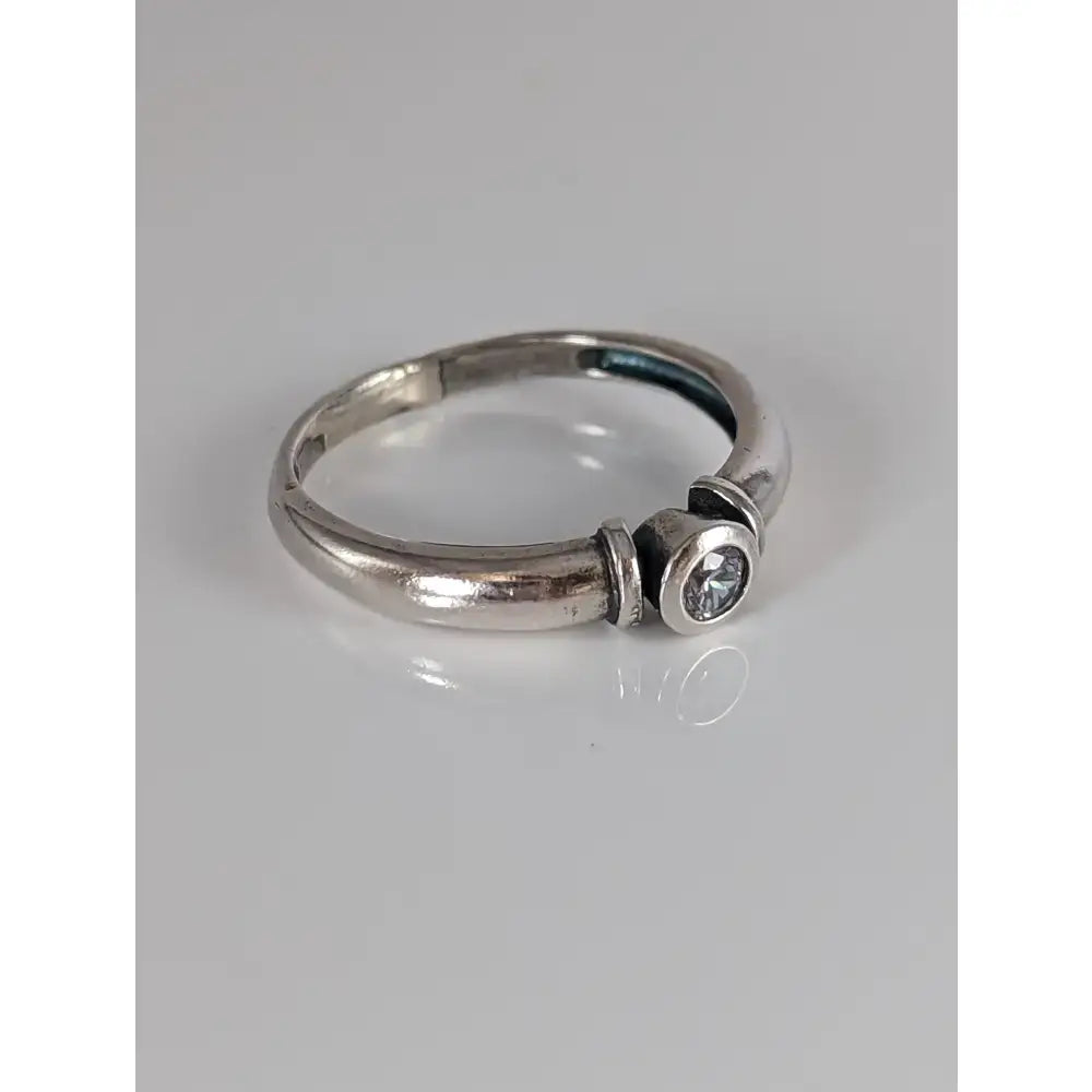 Silver steed silver sleek zirconia ring with a single round clear gemstone in a modern band design