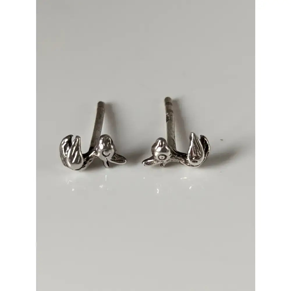 Silver steed rubber duck stud earrings in sterling silver with tiny dragon designs and textured scales open eyes