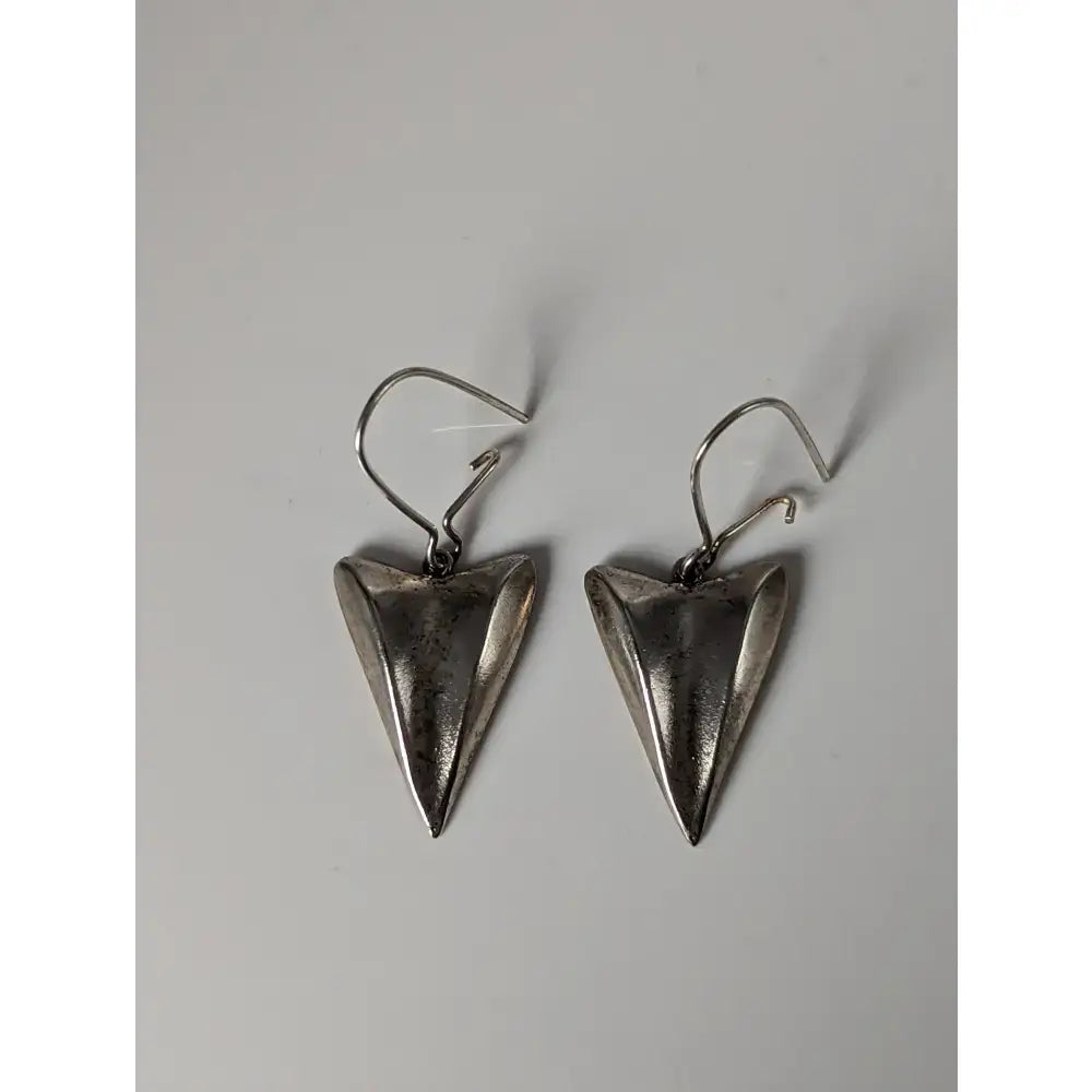Silver steed shamrock leaf dropped earrings feature silver triangular textured matte finish with simple hook clasps