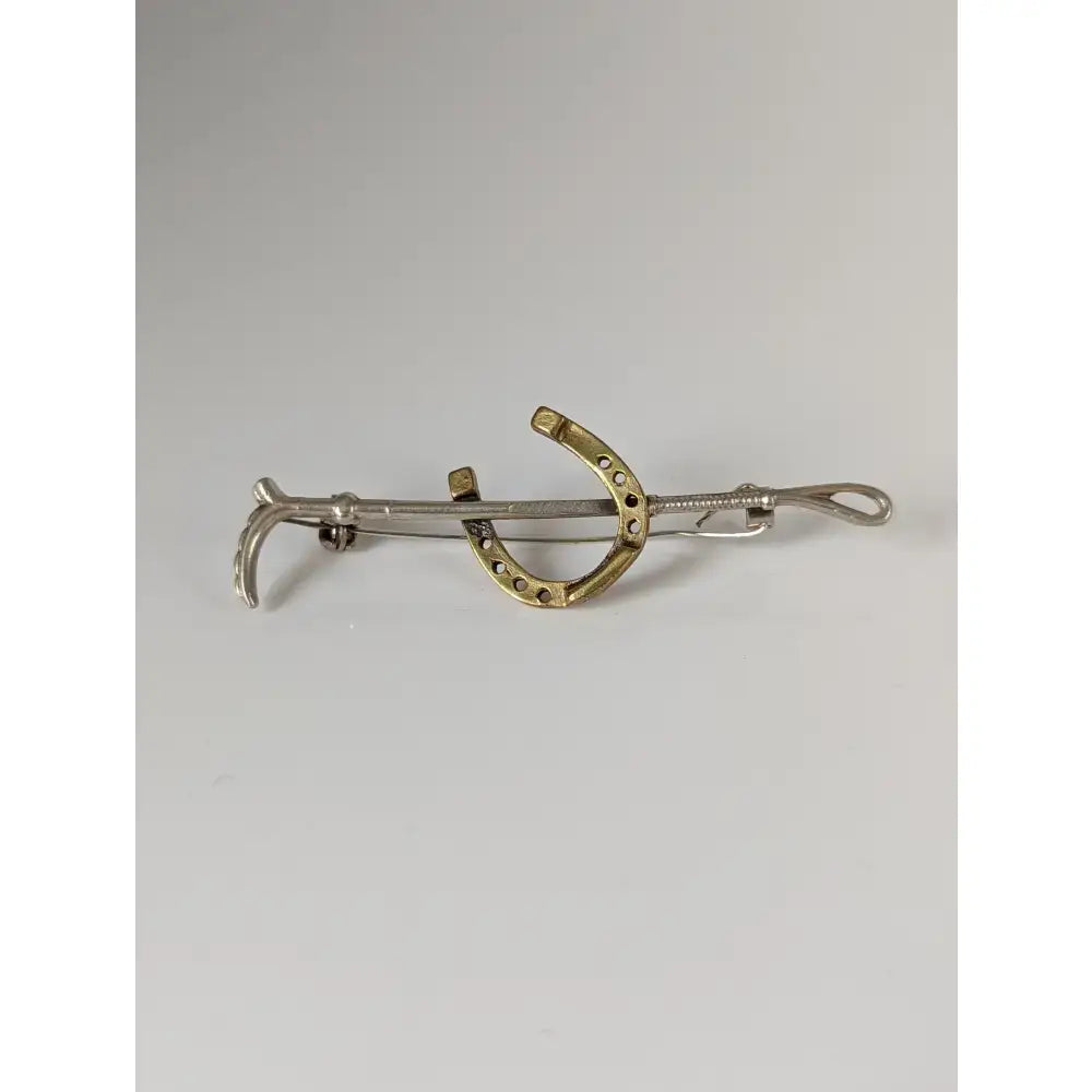 Silver steed shoe and cane gold brooch stock tie pin with polished silver and gold horseshoe design and intricate detailing