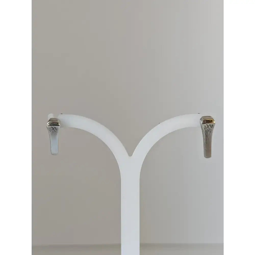 Silver steed short hoof nail stud earrings made of silver-toned metal with sleek minimalist design and subtle engraving