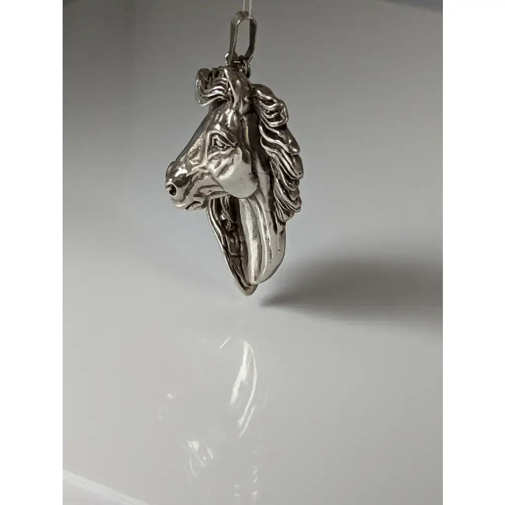 Silver steed signature horse head pendant in polished silver metal with detailed mane and facial features
