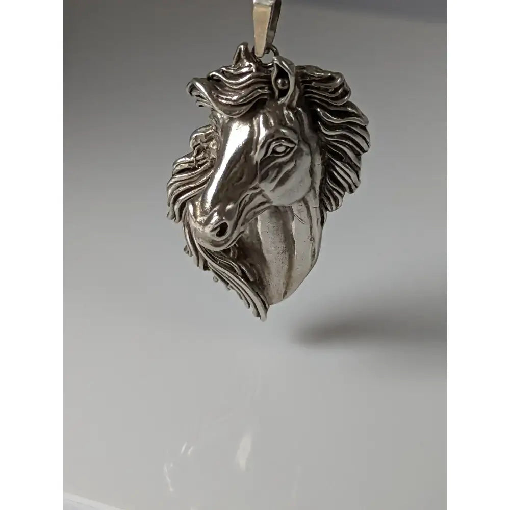 Silver steed signature horse head pendant with detailed mane and expressive eyes in metallic silver finish