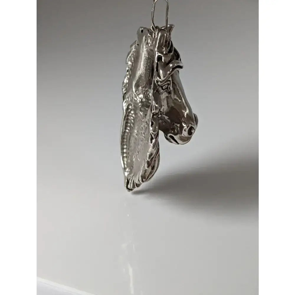 Silver steed signature horse head pendant in polished silver with intricate detailing and a sleek metallic finish