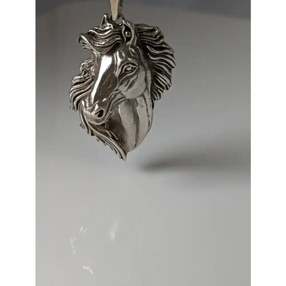 Silver steed signature horse head pendant in silver with detailed mane and expressive eyes crafted in metallic finish