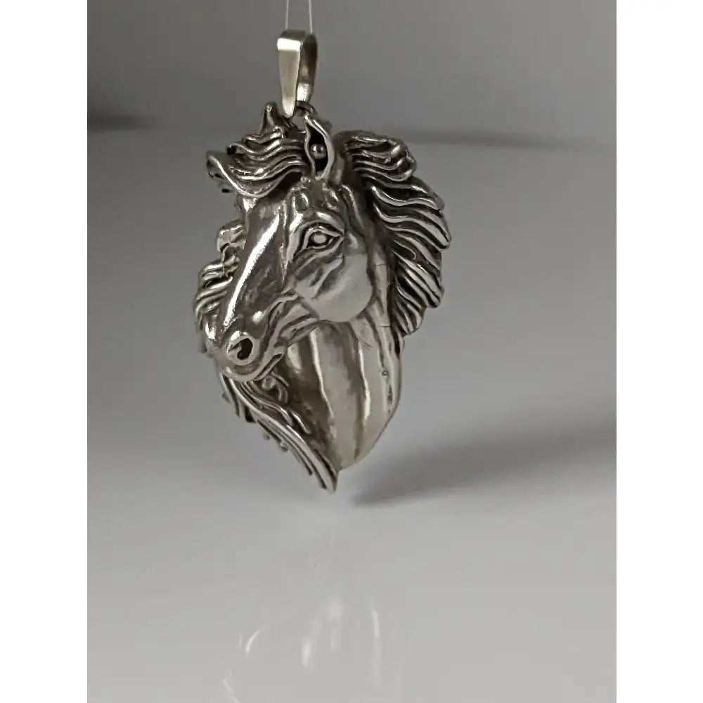 Silver steed signature horse head pendant with detailed mane in metallic silver finish for stylish wear
