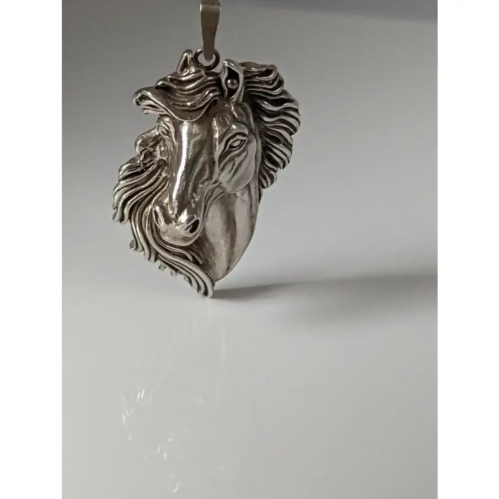 Silver steed signature horse head pendant in silver with detailed mane and expressive eyes in metallic finish