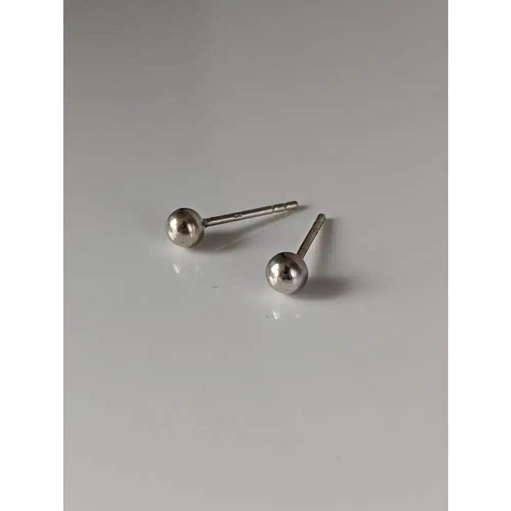 Silver steed small ball stud earrings featuring minimalist polished silver ball stud earrings with a reflective finish