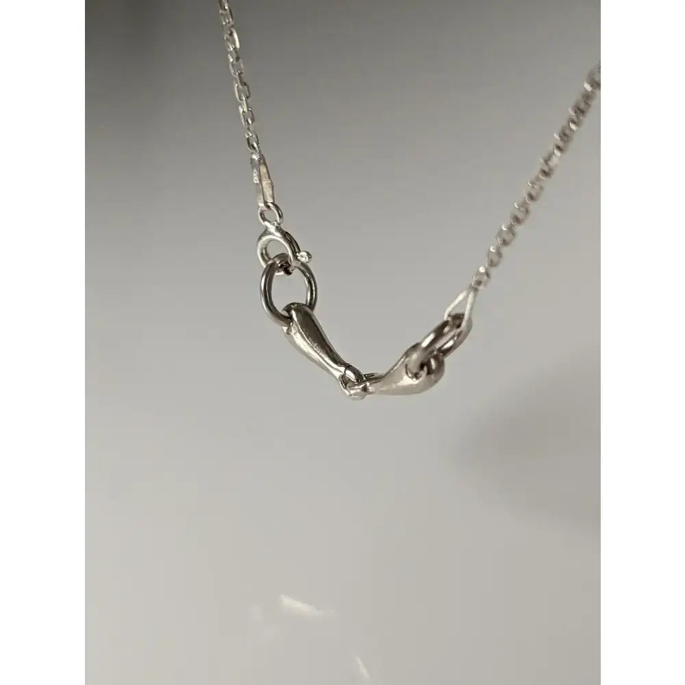 Silver steed snaffle necklace with a silver horsebit-style chain clasp on a delicate link silver steed necklace