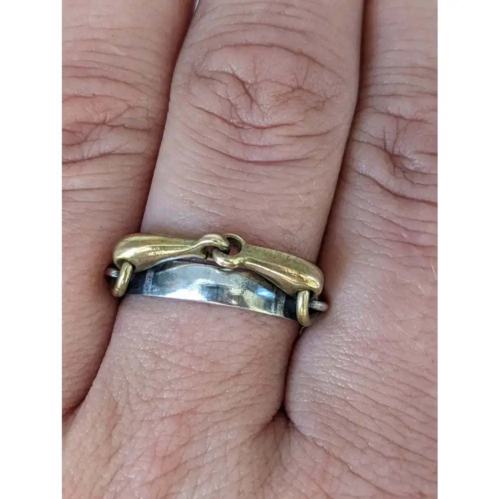 Gold-toned horsebit style ring with a silver band from the silver steed snaffle collection