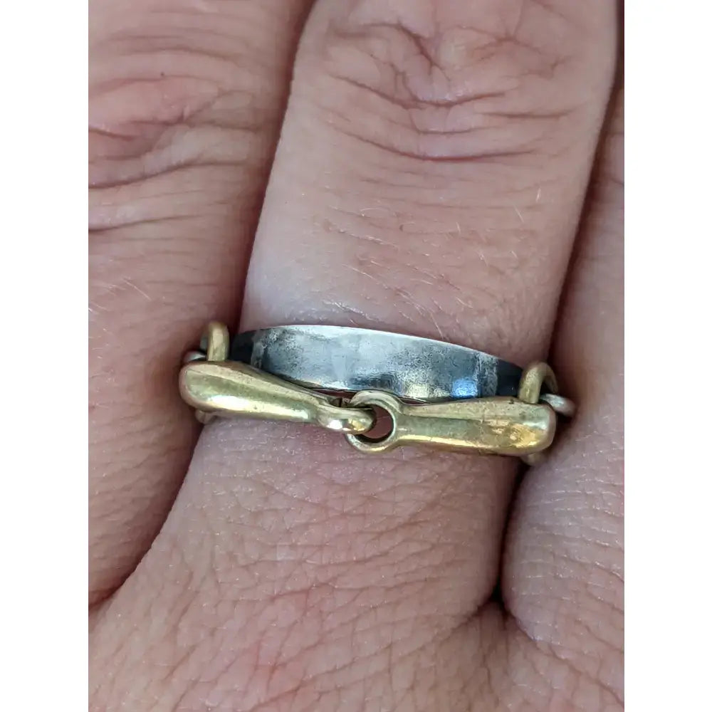 Silver steed snaffle two-tone horsebit ring with silver band and gold-toned buckle for stylish wear