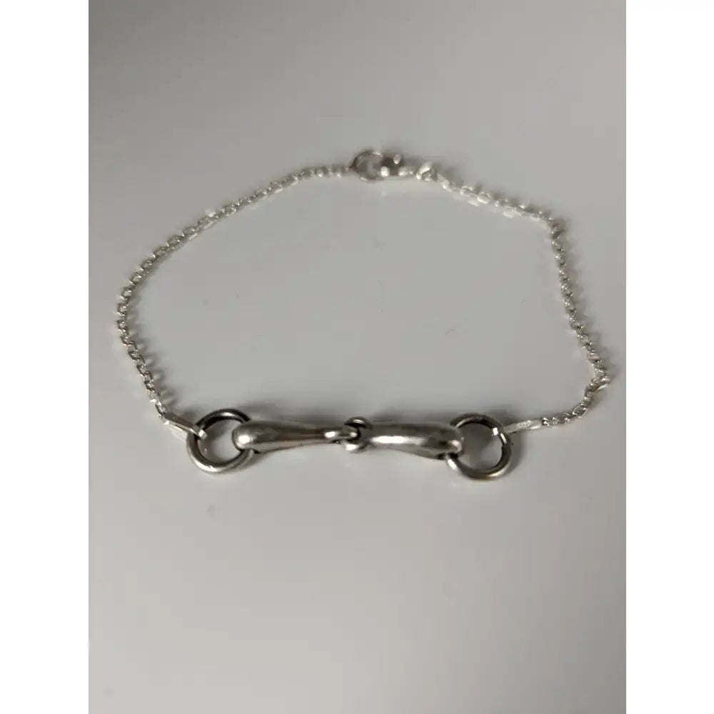 Silver steed snaffle chain delicate bracelet featuring a silver horsebit with a twisted chain and polished metal finish