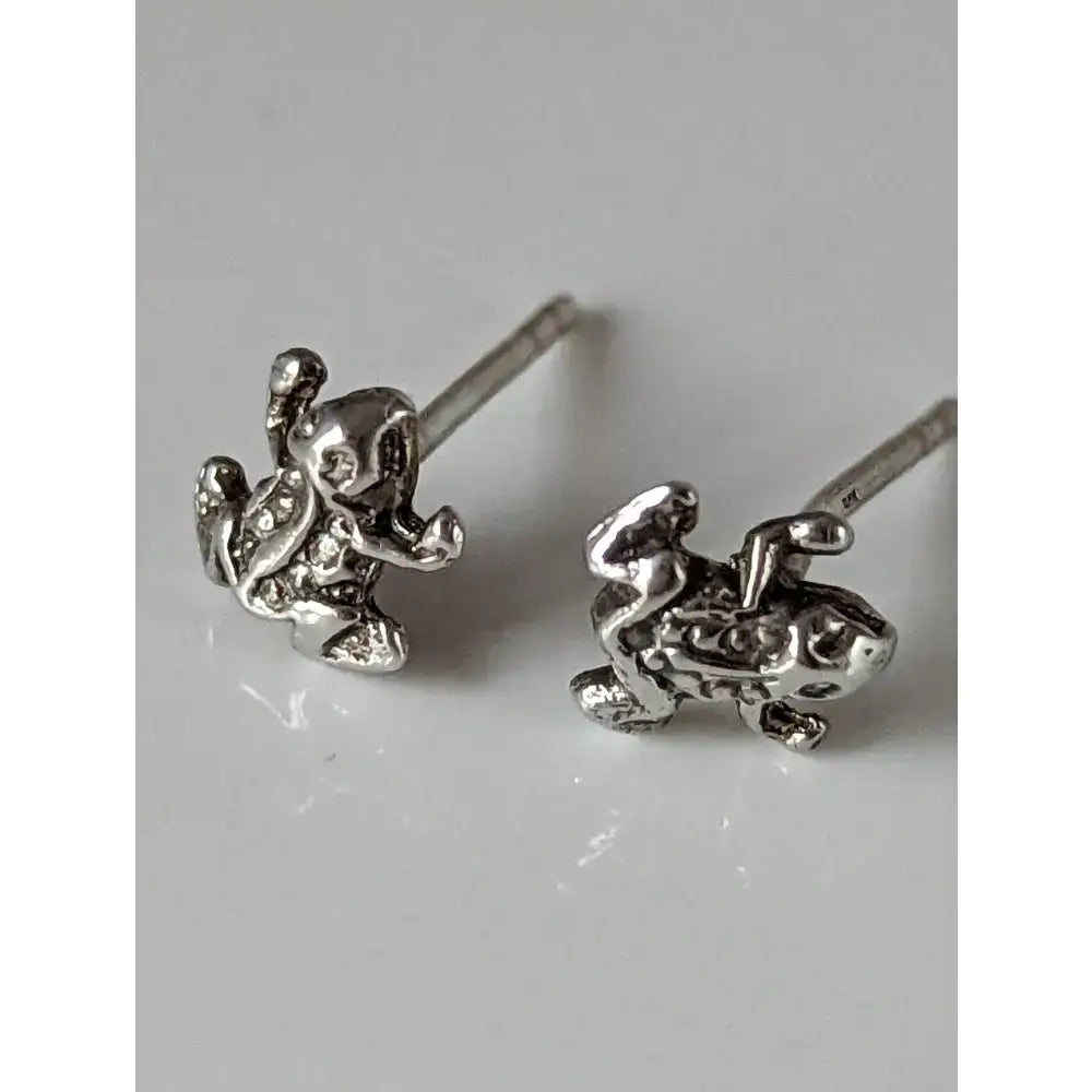 Silver steed spotted frog stud earrings in silver with miniature intricate frog designs and tiny embedded stones