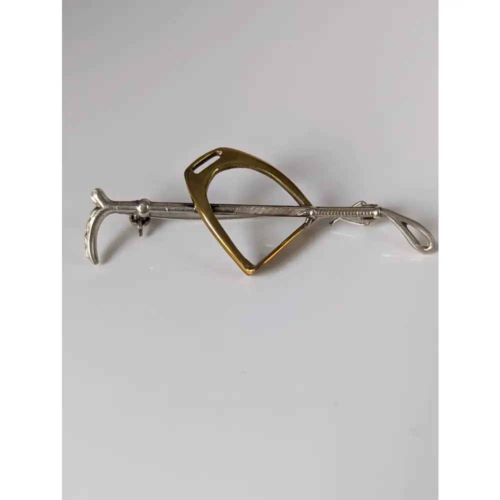 Silver steed stirrup two-tone handmade silver cane brooch featuring gold horseshoe and silver stirrup bar design
