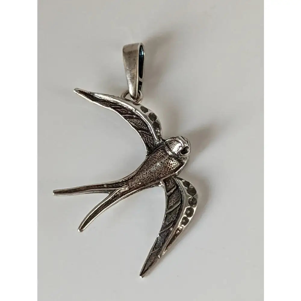 Silver steed swallow silver pendant with detailed engraved wings and textured sterling silver body