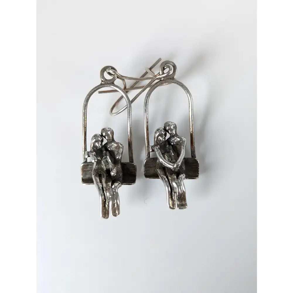 Silver steed swing silver earrings with couple dropped earrings featuring swing seat loved up sculpted figures