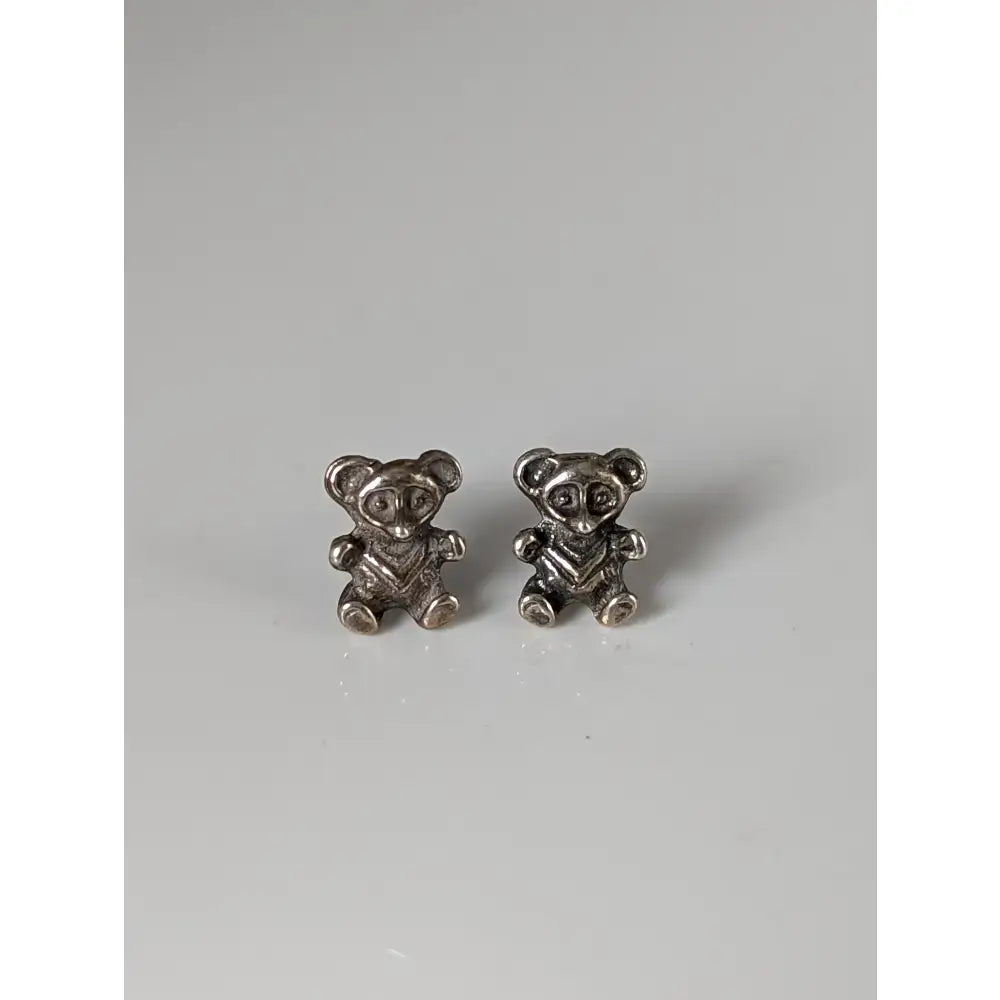 Silver steed teddy silver teddy bear stud earrings with detailed faces and textured fabric patterns on their bodies