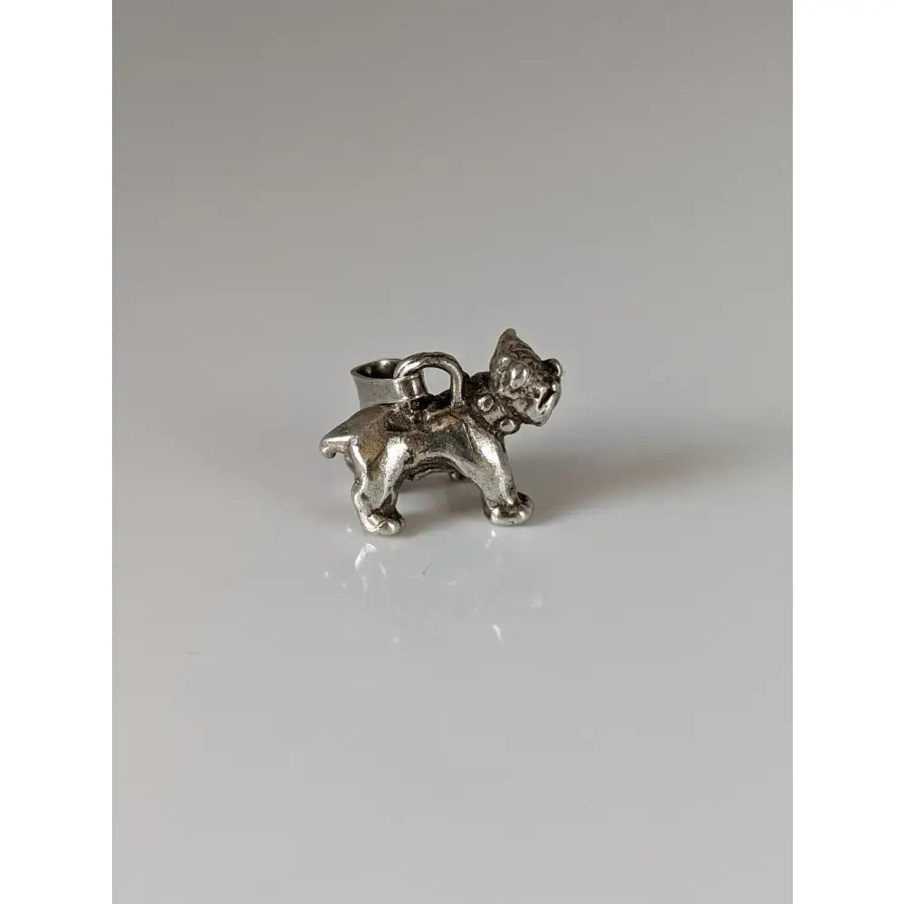 Silver steed terrier silver pendant featuring a silver bulldog charm with a miniature purse on its back