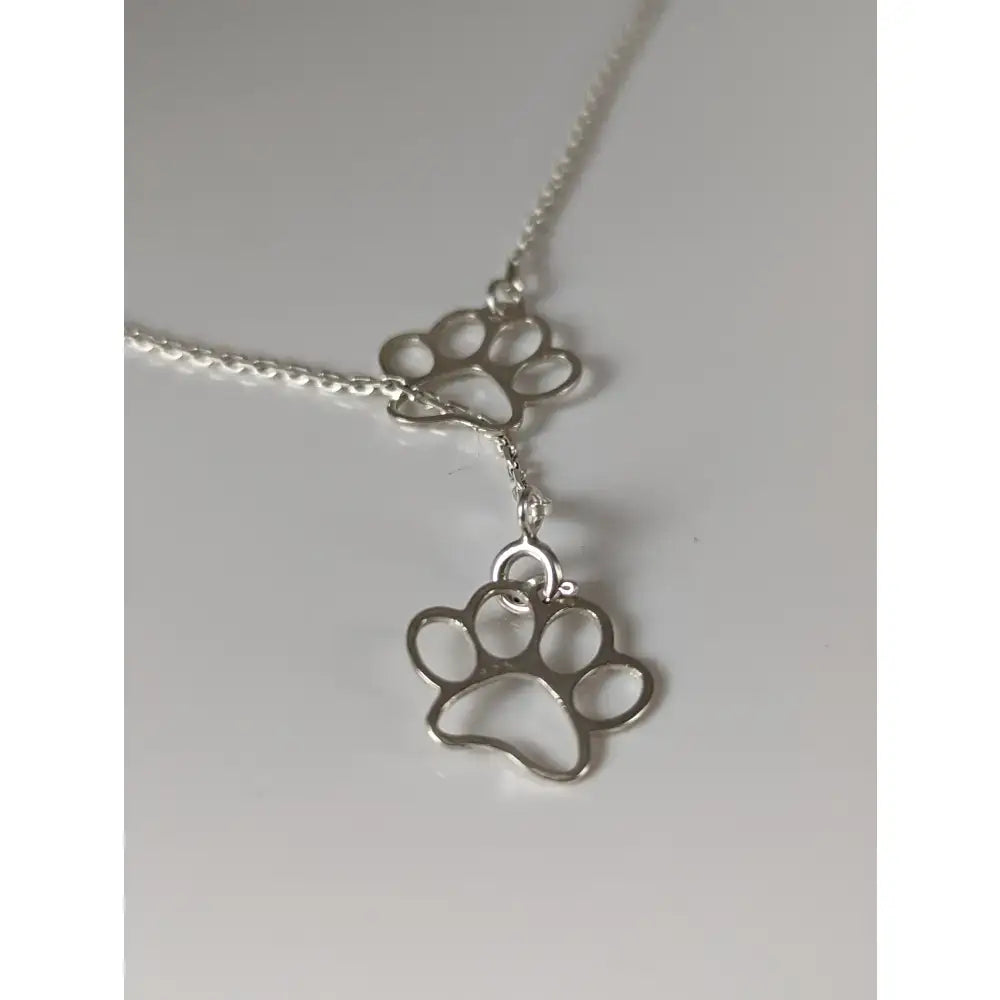 Silver steed thread double paw print silver necklace with delicate silver paw print pendant and thin chain