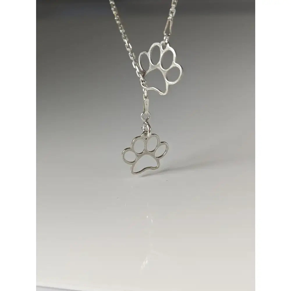 Silver steed thread double paw print silver necklace with delicate chain and shiny silver paw print pendant