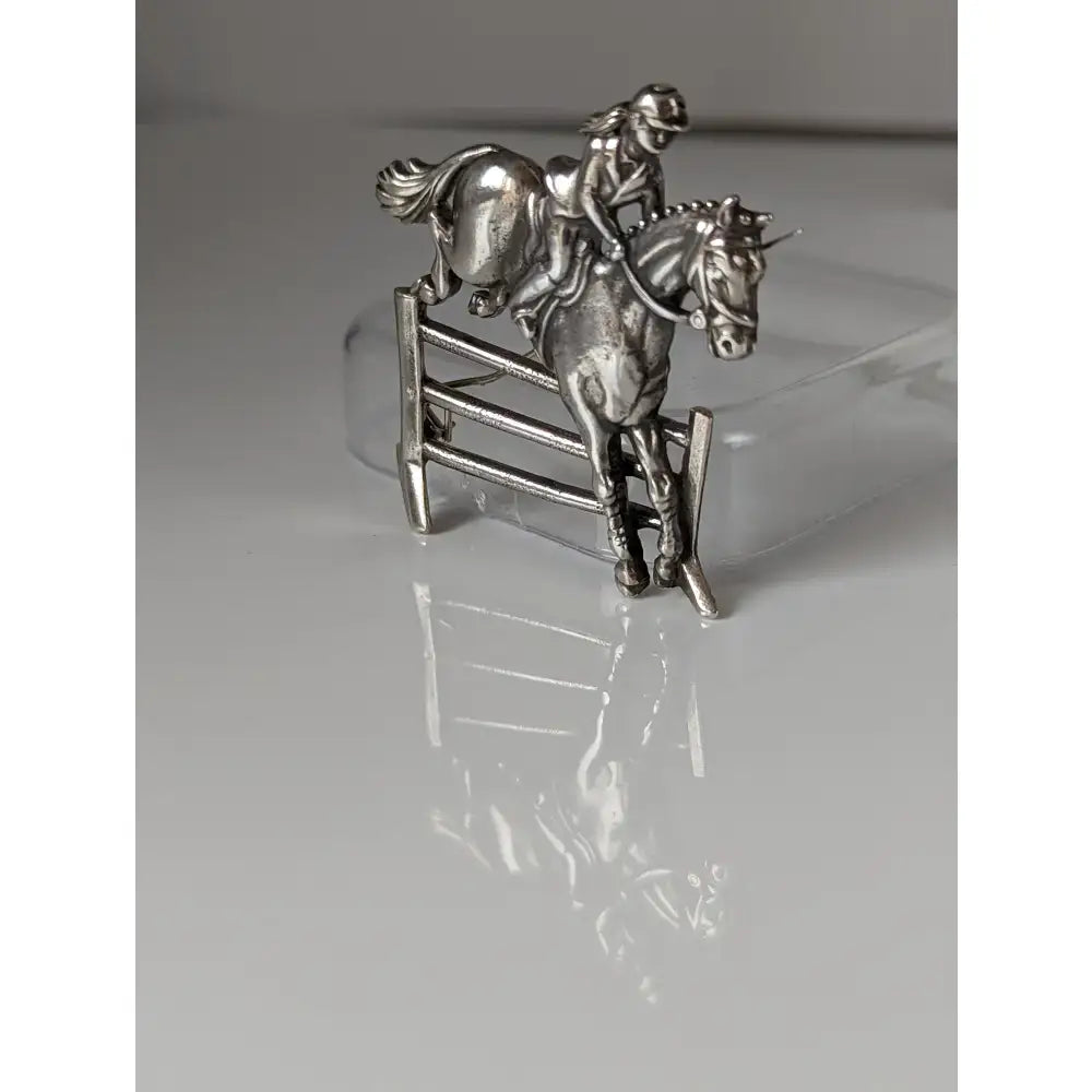 Silver steed triple equestrian jumping brooch in silver designed as rider and horse mid-jump with stock tie pin option