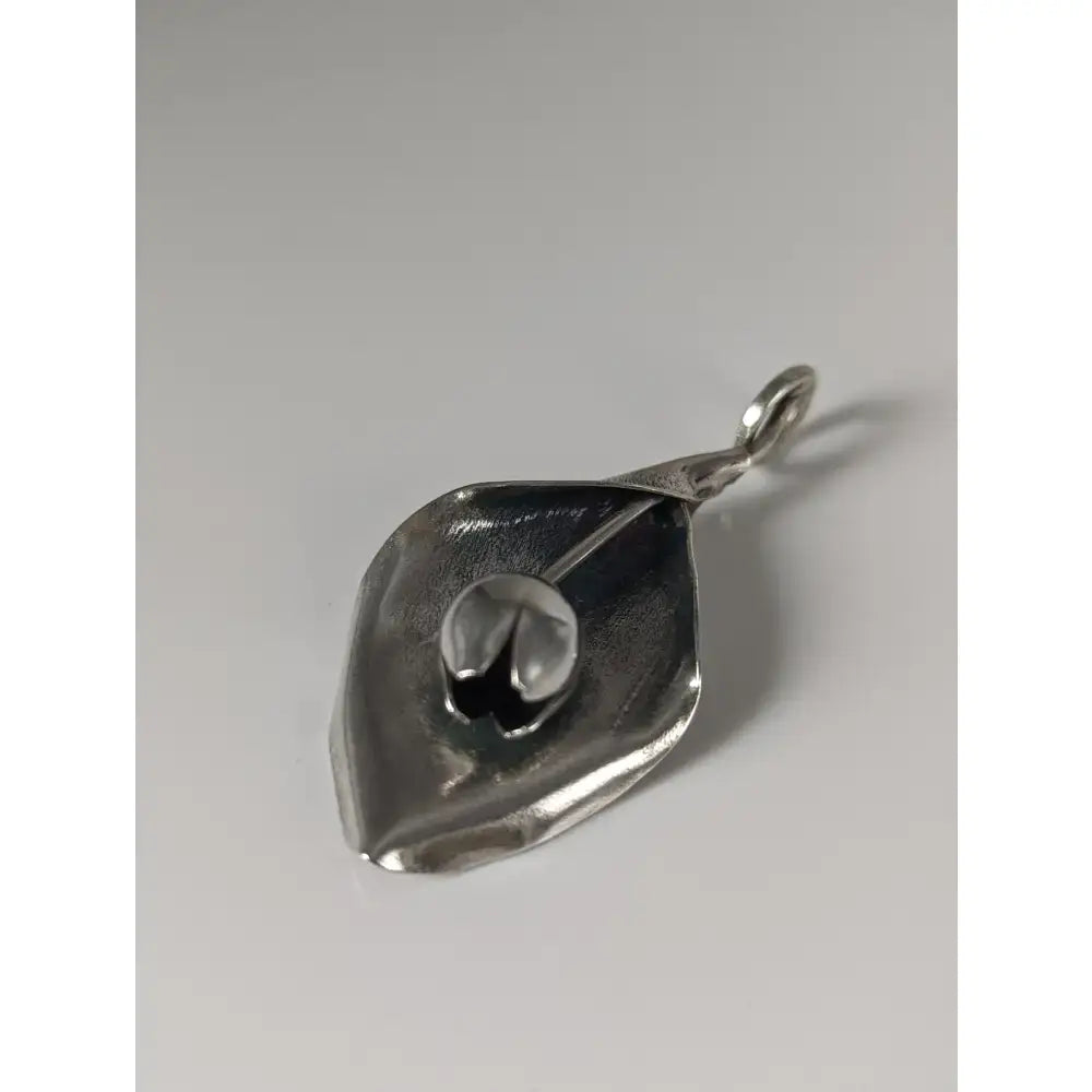 Silver steed tulip pendant featuring a textured hand-forged finish and small loop for easy attachment