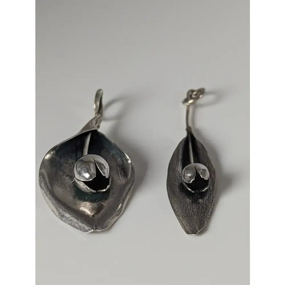 Silver steed tulip silver leaf-shaped earrings with textured handcrafted finish and small spherical accents