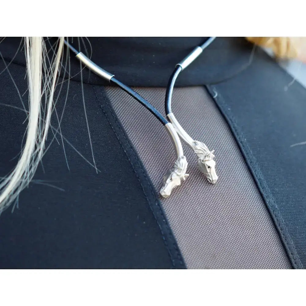 Silver steed two horse heads pendant necklace with leather cord and metallic accents in silver and black