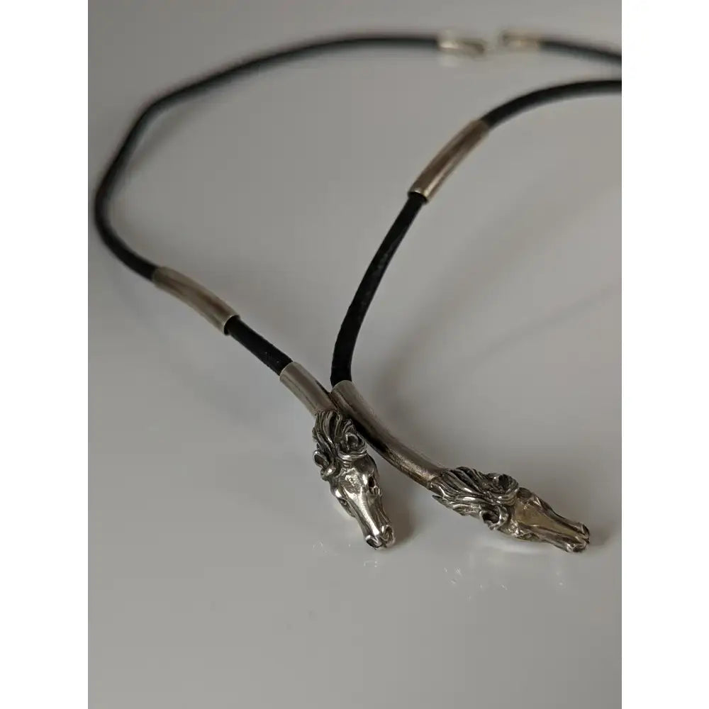 Silver steed two horse heads leather cord necklace with silver horse head pendant and metallic accents