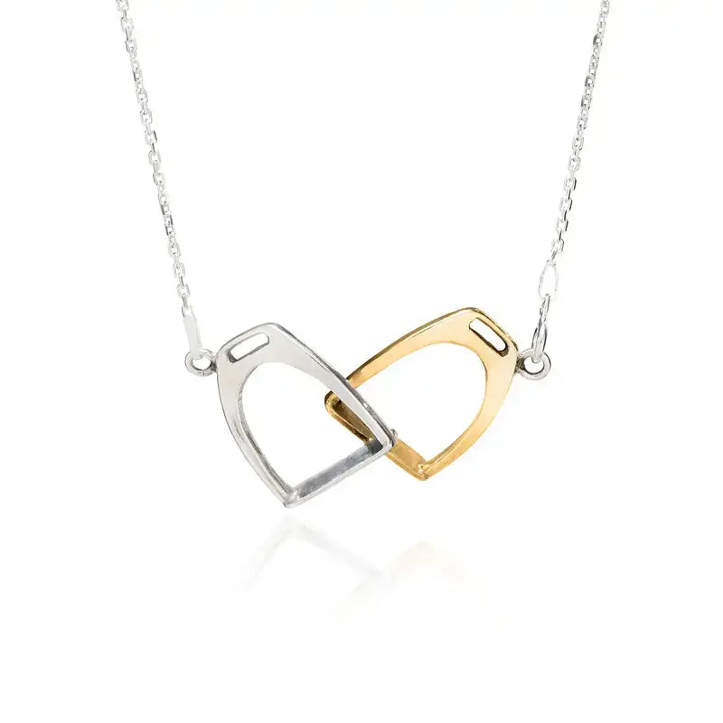 A delicate silver steed two stirrups necklace with interlocking silver and gold horsebit pendants on a fine chain