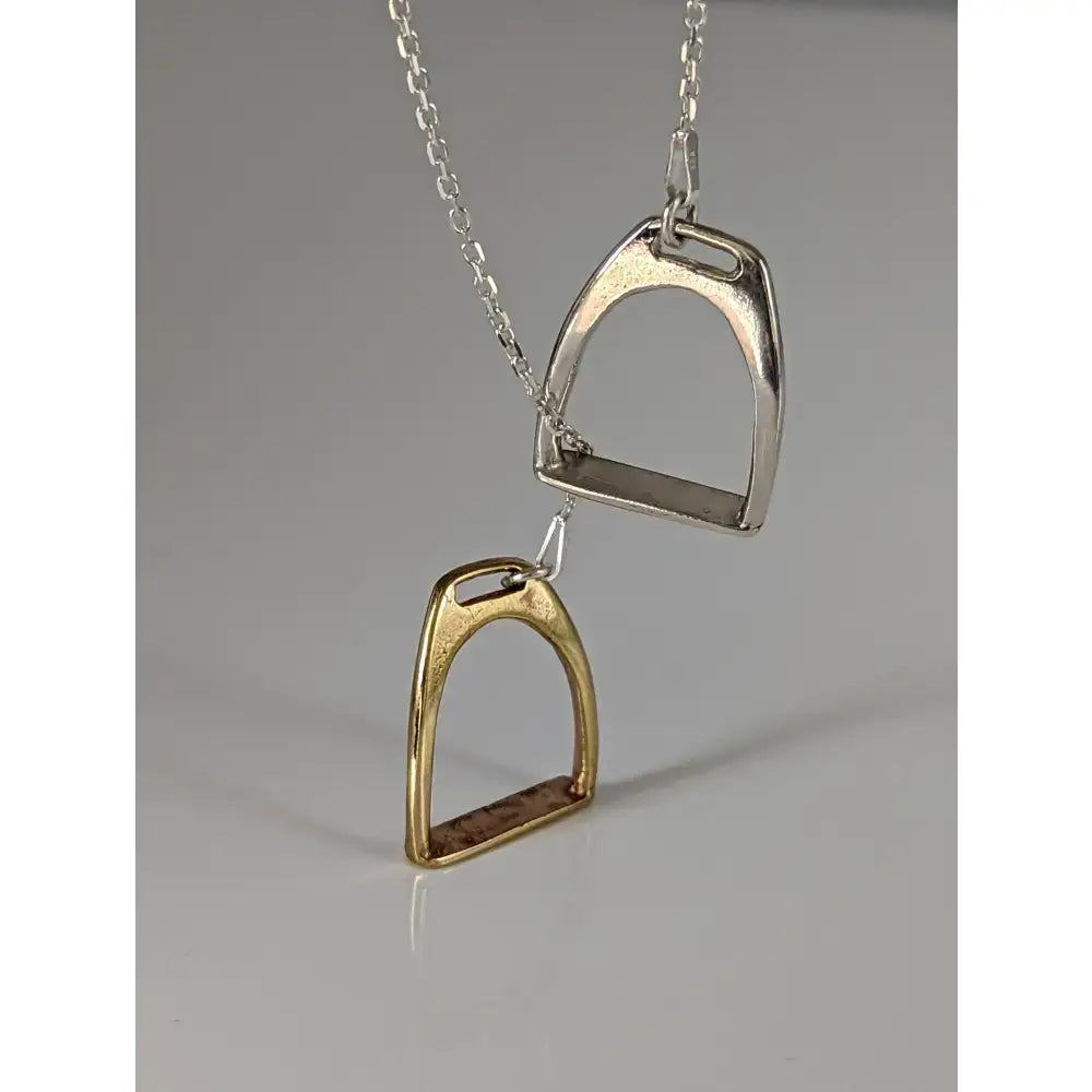 Silver steed equestrian jewelry featuring a silver and gold-toned two stirrups necklace with chain