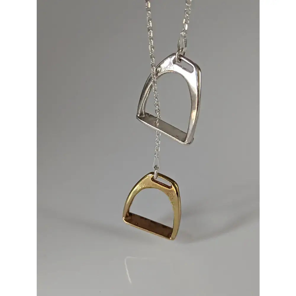 Silver steed equestrian jewelry featuring a silver and gold two stirrups necklace pendant with a matching chain