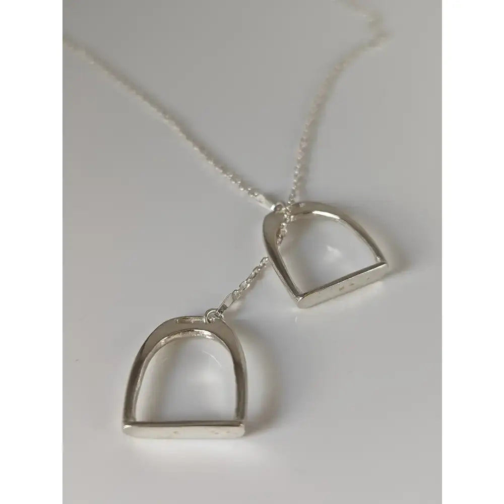 Silver steed equestrian jewelry featuring a silver two stirrups necklace pendant on a delicate chain