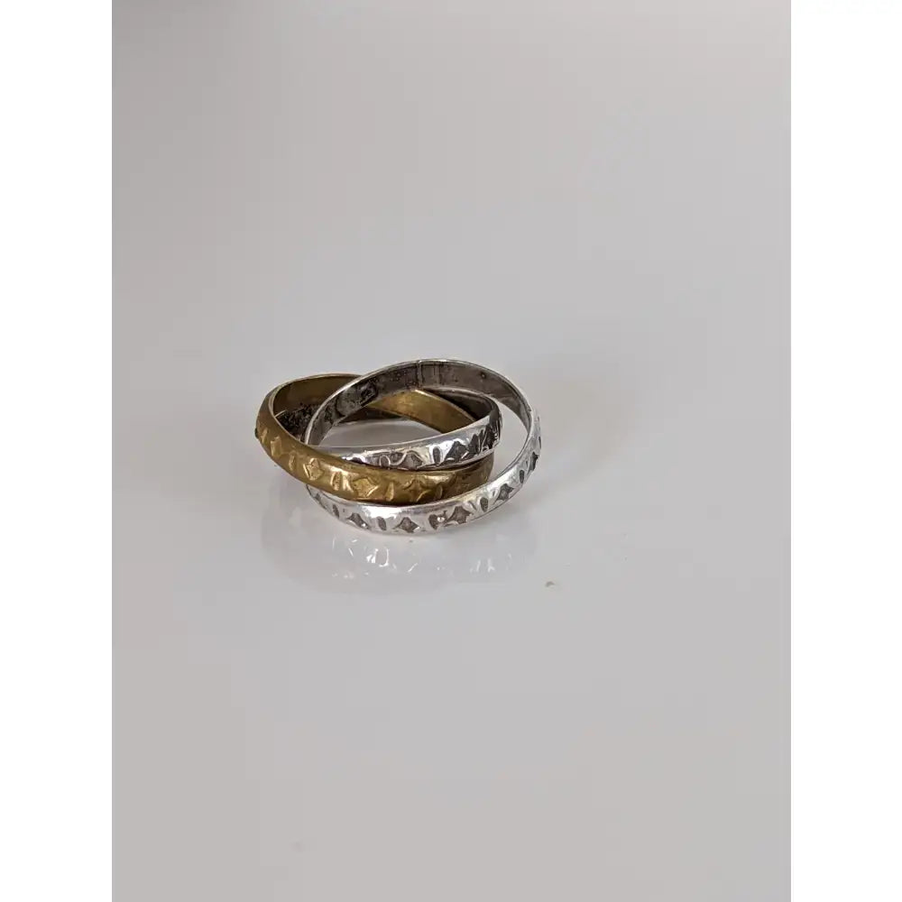Silver steed two tone three interlinking bands featuring textured silver and polished gold three interlinking bands