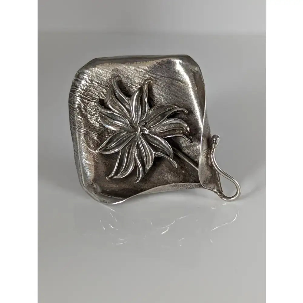 Silver steed unique silver brooch with raised star flower design and hand-forged metalwork hook for fastening