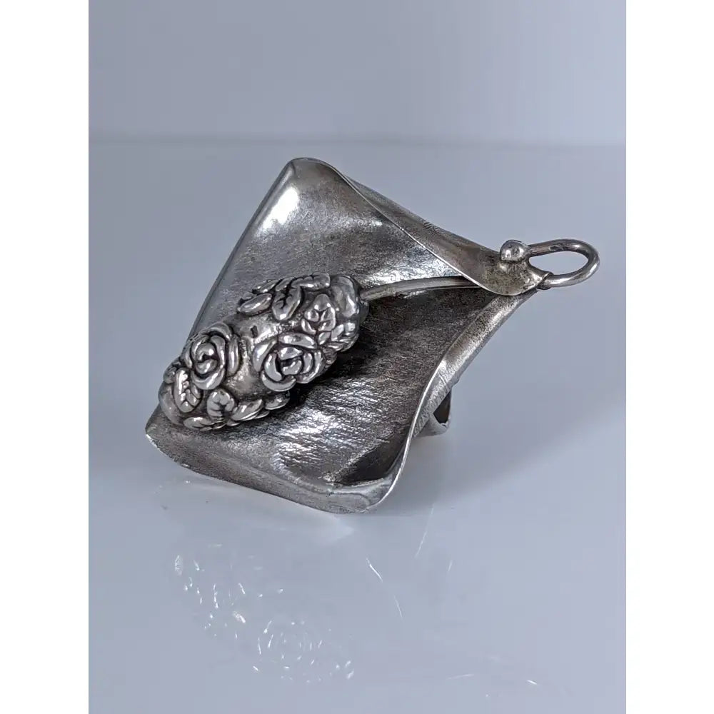 Silver steed unique silver-toned metal pendant shaped like a calla lily with detailed rose cluster in extravagant leaf rings design